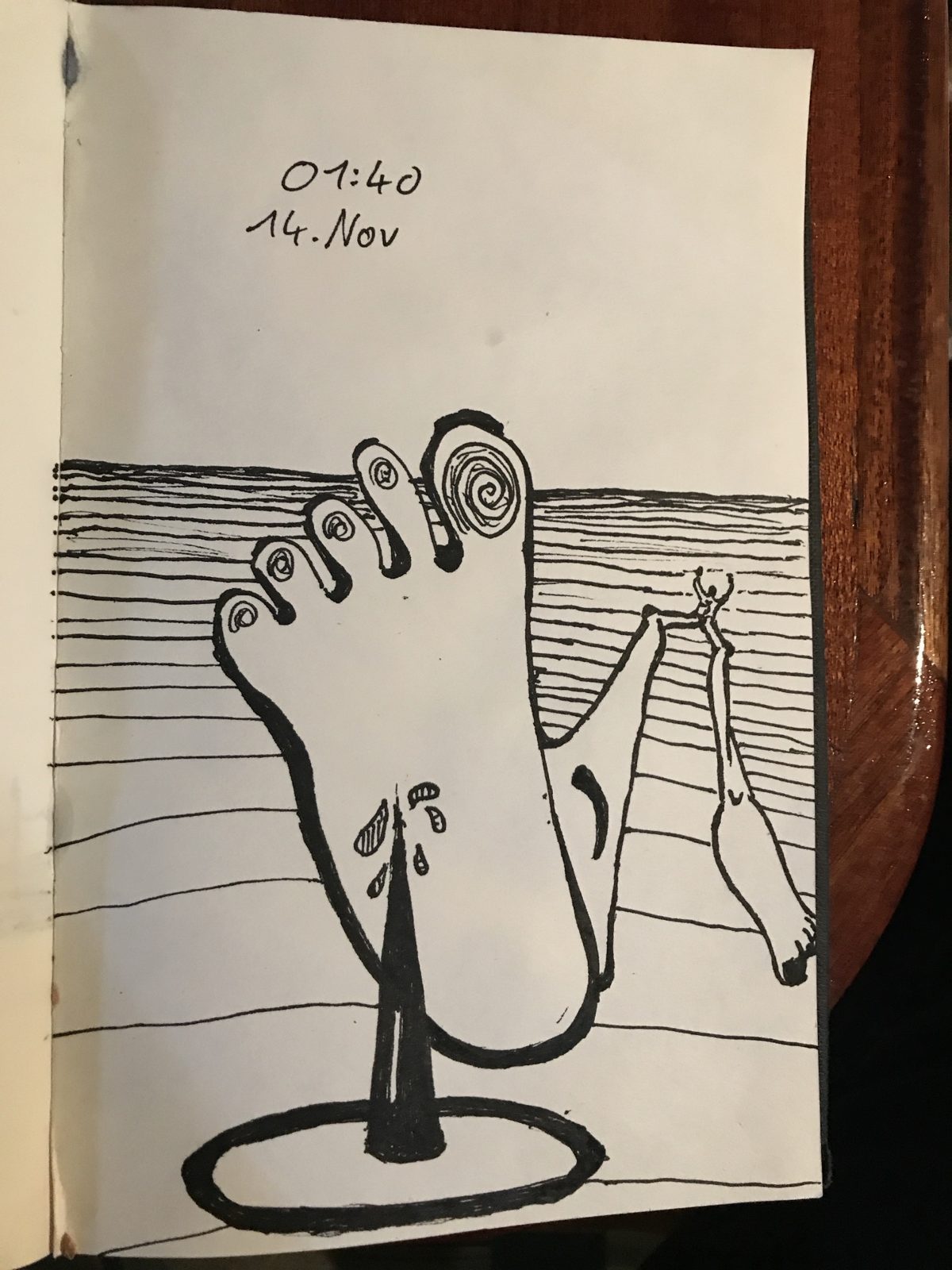 Ink drawing of a giant foot on a spike, a tiny figure balancing on a leg in the distance