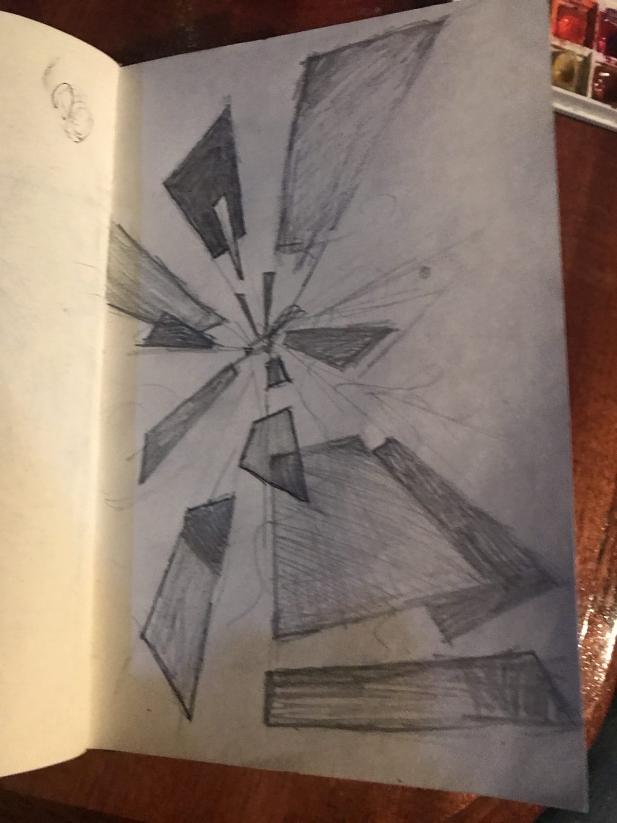 Pencil drawing of shards flying out from a center