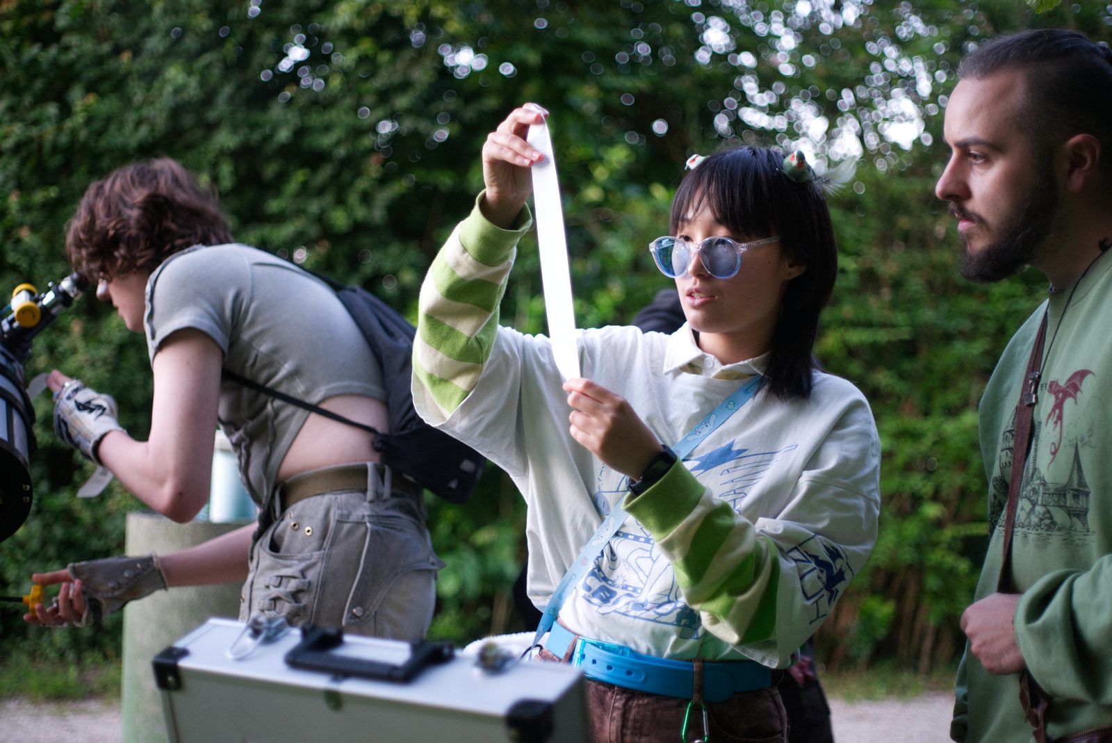 Visitors reading their DreamAtlas receipts outdoors