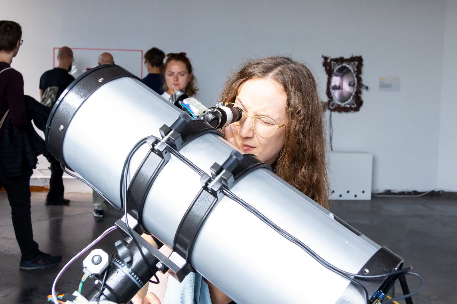 A visitor looking through the DreamAtlas telescope