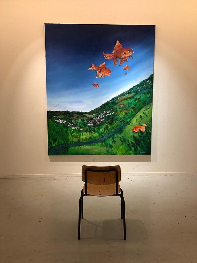 Painting of a landscape with goldfish in the sky