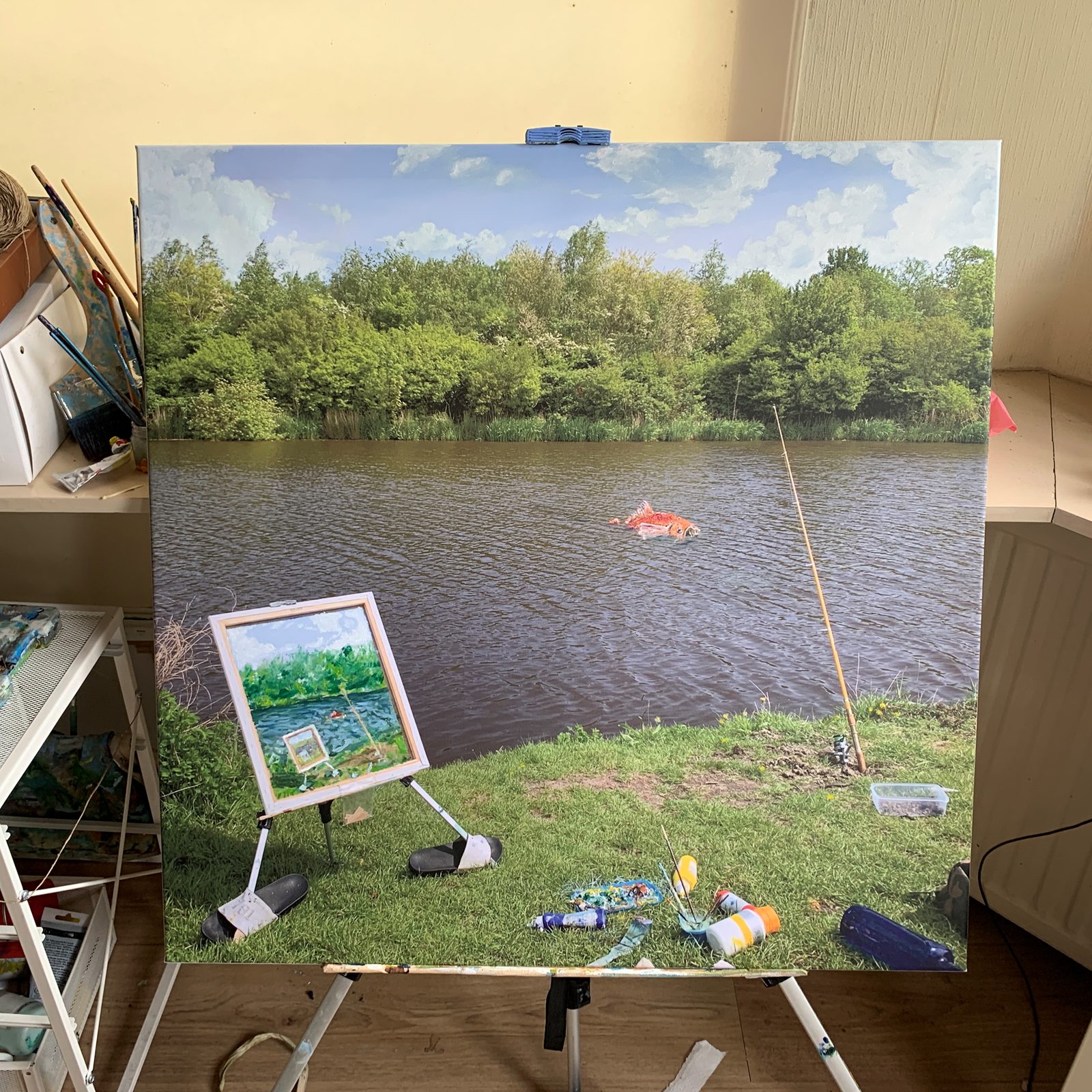 Painting of a painting session at a river, on top of a printed photograph