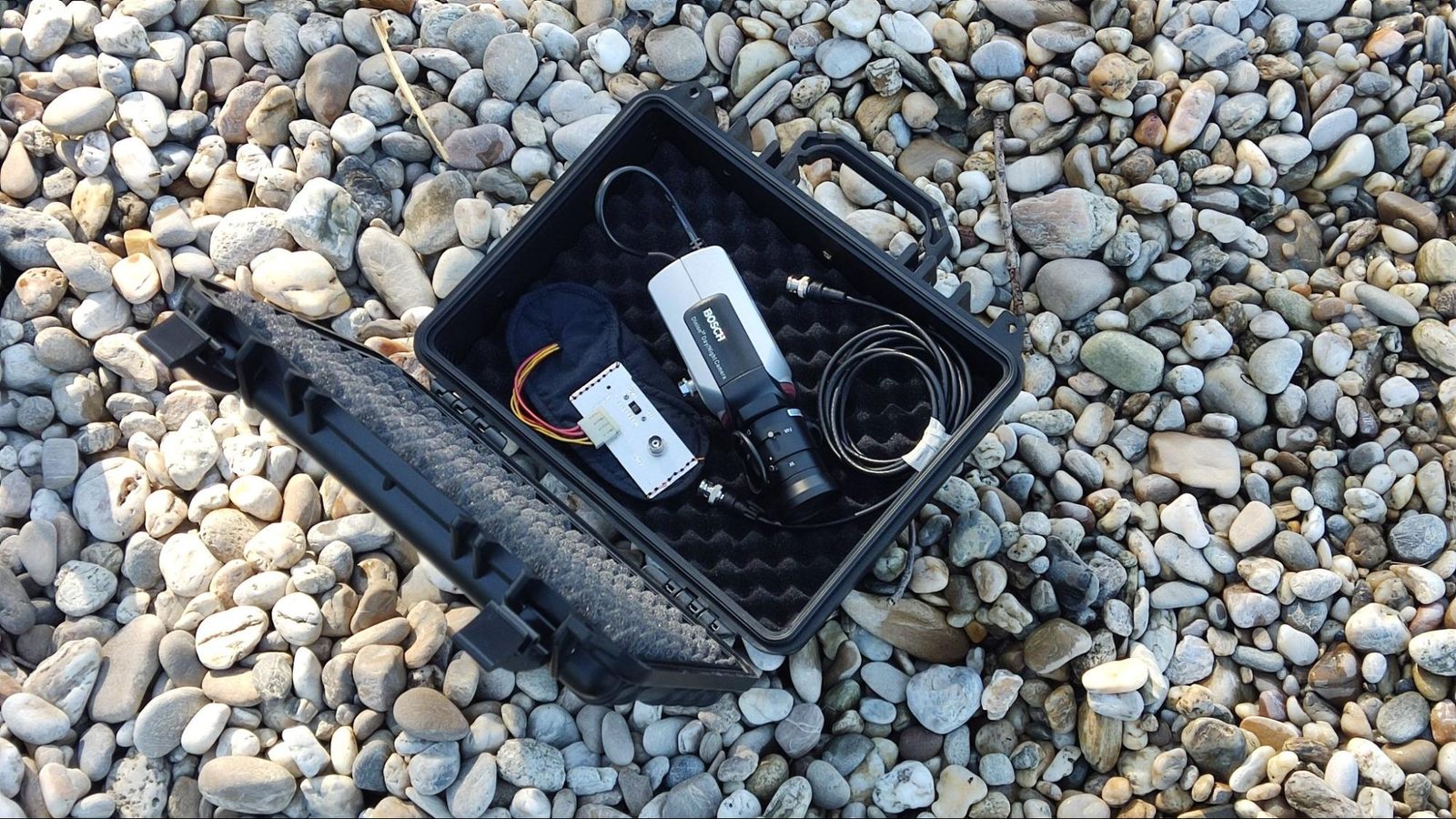 Pareidolia: an open case with electronics on gravel